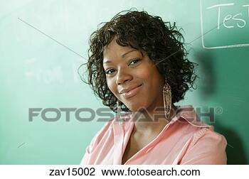 Stock Photo - woman standing 
by blackboard. 
fotosearch - search 
stock photos, 
pictures, images, 
and photo clipart
