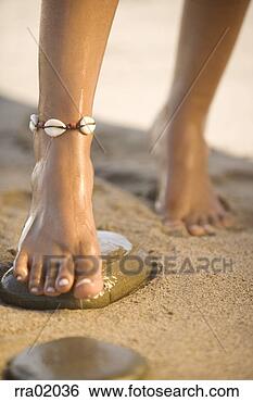 Stock Photo - woman stepping 
on large stone. 
fotosearch - search 
stock photos, 
pictures, images, 
and photo clipart