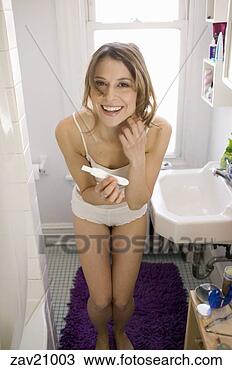 Stock Photo - woman taking pregnancy 
test. fotosearch 
- search stock 
photos, pictures, 
images, and photo 
clipart