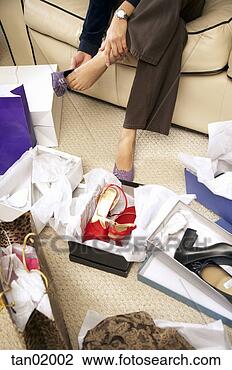 Stock Photo - woman trying on 
shoes. fotosearch 
- search stock 
photos, pictures, 
images, and photo 
clipart