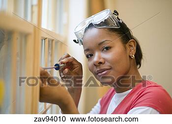 Stock Photography - woman unscrewing 
windowpane. fotosearch 
- search stock 
photos, pictures, 
images, and photo 
clipart