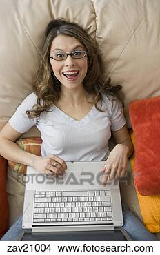 Stock Photo - woman using laptop 
in bed. fotosearch 
- search stock 
photos, pictures, 
images, and photo 
clipart