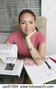 Stock Photo - woman using sewing 
machine. fotosearch 
- search stock 
photos, pictures, 
images, and photo 
clipart