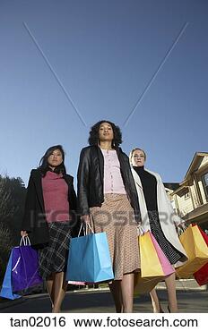Stock Photo - women carrying 
shopping bags. 
fotosearch - search 
stock photos, 
pictures, images, 
and photo clipart