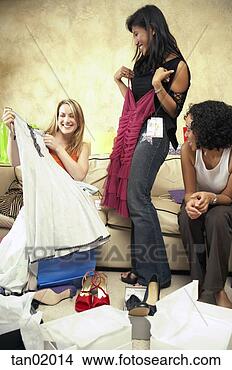Stock Photo - women comparing 
new clothes. fotosearch 
- search stock 
photos, pictures, 
images, and photo 
clipart