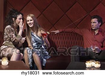Stock Photography - women gossiping 
in bar. fotosearch 
- search stock 
photos, pictures, 
images, and photo 
clipart