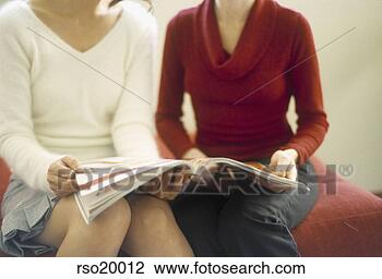 Stock Photo - women holding 
magazine. fotosearch 
- search stock 
photos, pictures, 
images, and photo 
clipart