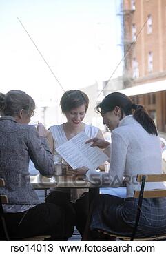 Stock Photo - women reading 
menu at outdoor 
restaurant. fotosearch 
- search stock 
photos, pictures, 
images, and photo 
clipart