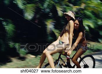 Picture - women riding on 
bicyle handlebars 
in string bikini. 
fotosearch - search 
stock photos, 
pictures, images, 
and photo clipart