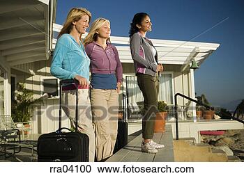 Stock Photography - women with suitcases 
arriving at vacation 
home. fotosearch 
- search stock 
photos, pictures, 
images, and photo 
clipart