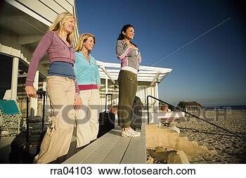 Stock Photo - women with suitcases 
arriving at vacation 
home. fotosearch 
- search stock 
photos, pictures, 
images, and photo 
clipart