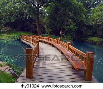 Stock Photo - wood bridge over 
river, hang zhou, 
china. fotosearch 
- search stock 
photos, pictures, 
images, and photo 
clipart