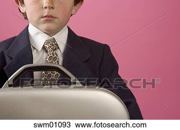 Stock Photo - young boy in business 
suit holding metal 
suitcase. fotosearch 
- search stock 
photos, pictures, 
images, and photo 
clipart