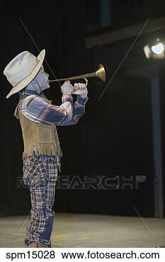 Stock Photo - young boy in cowboy 
costume blowing 
horn. fotosearch 
- search stock 
photos, pictures, 
images, and photo 
clipart