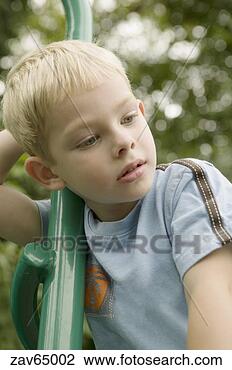 Stock Photo - young boy daydreaming. 
fotosearch - search 
stock photos, 
pictures, images, 
and photo clipart