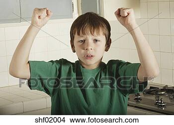 Stock Photo - young boy holding 
up fists. fotosearch 
- search stock 
photos, pictures, 
images, and photo 
clipart