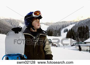 Stock Photo - young boy holding 
snowboard on slopes, 
cascade mountains, 
washington. fotosearch 
- search stock 
photos, pictures, 
images, and photo 
clipart