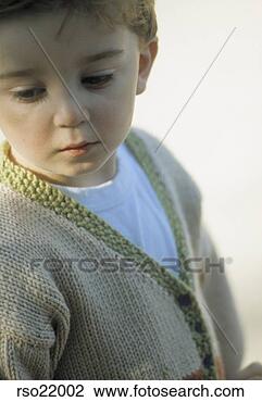 Stock Photo - young boy in knit 
sweater. fotosearch 
- search stock 
photos, pictures, 
images, and photo 
clipart