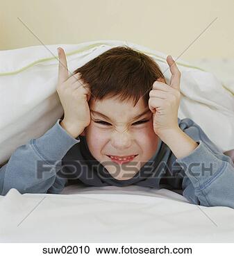 Stock Photography - young boy making 
devil horns. fotosearch 
- search stock 
photos, pictures, 
images, and photo 
clipart