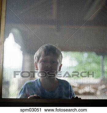 Stock Photography - young boy's nose 
pressed against 
screen door. fotosearch 
- search stock 
photos, pictures, 
images, and photo 
clipart
