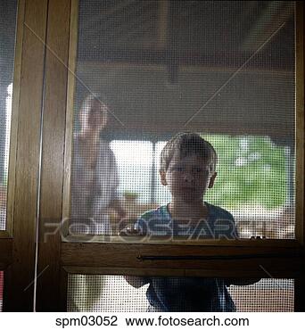 Stock Photo - young boy's nose 
pressed against 
screen door. fotosearch 
- search stock 
photos, pictures, 
images, and photo 
clipart