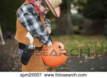 Picture - young boy trick 
or treating on 
halloween. fotosearch 
- search stock 
photos, pictures, 
images, and photo 
clipart