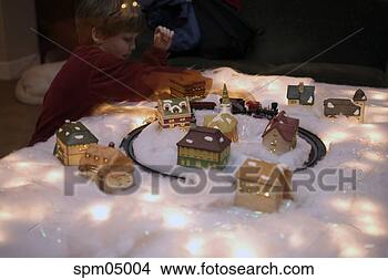 Stock Photo - young boy using 
train set. fotosearch 
- search stock 
photos, pictures, 
images, and photo 
clipart