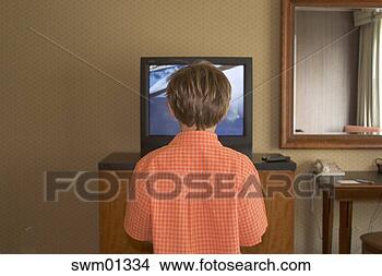 Stock Photo - young boy watching 
television. fotosearch 
- search stock 
photos, pictures, 
images, and photo 
clipart