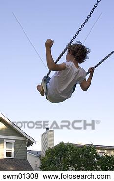 Stock Photo - young child swinging. 
fotosearch - search 
stock photos, 
pictures, images, 
and photo clipart