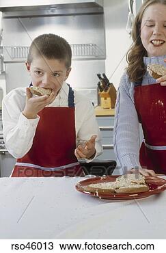 Stock Photo - young children 
eating cookies. 
fotosearch - search 
stock photos, 
pictures, images, 
and photo clipart