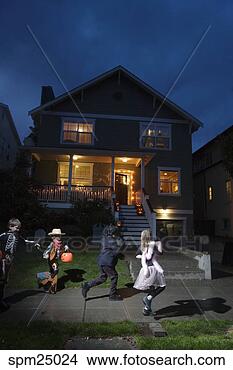 Stock Photo - young children 
trick or treating 
on halloween. 
fotosearch - search 
stock photos, 
pictures, images, 
and photo clipart