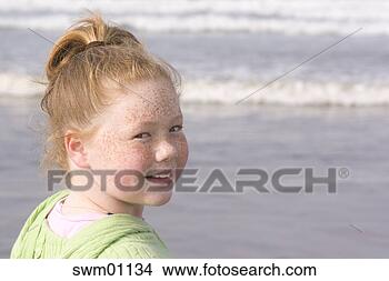Stock Photo - young girl on 
the beach. fotosearch 
- search stock 
photos, pictures, 
images, and photo 
clipart