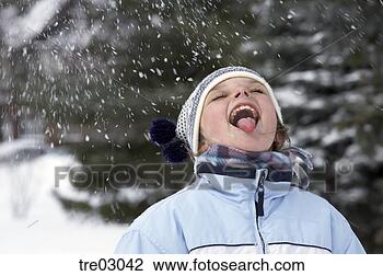 Stock Photo - young girl catching 
snowflakes on 
tongue. fotosearch 
- search stock 
photos, pictures, 
images, and photo 
clipart