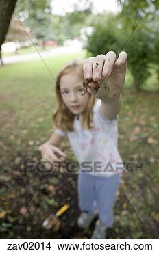 Stock Photo - young girl displaying 
worm in backyard. 
fotosearch - search 
stock photos, 
pictures, images, 
and photo clipart