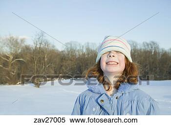 Stock Image - young girl grinning 
in snow. fotosearch 
- search stock 
photos, pictures, 
images, and photo 
clipart
