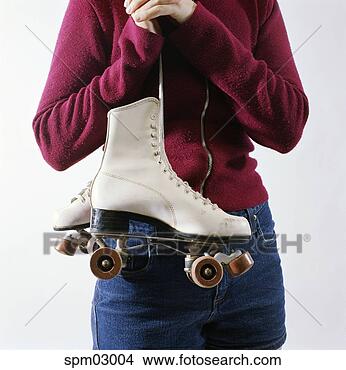 Stock Photo - young girl holding 
roller skates. 
fotosearch - search 
stock photos, 
pictures, images, 
and photo clipart