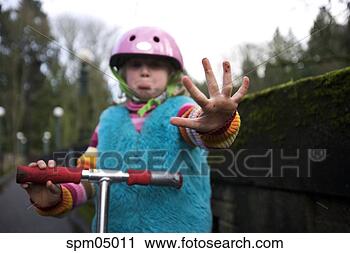 Stock Photography - young girl holding 
out hurt fingers. 
fotosearch - search 
stock photos, 
pictures, images, 
and photo clipart