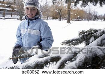 Stock Photo - young girl standing 
in snow. fotosearch 
- search stock 
photos, pictures, 
images, and photo 
clipart