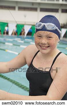 Stock Photography - young girl swimming 
at indoor pool. 
fotosearch - search 
stock photos, 
pictures, images, 
and photo clipart