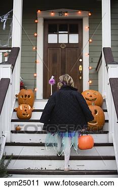 Stock Photography - young girl trick 
or treating on 
halloween. fotosearch 
- search stock 
photos, pictures, 
images, and photo 
clipart