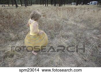 Stock Photo - young girl twirling 
her skirt. fotosearch 
- search stock 
photos, pictures, 
images, and photo 
clipart