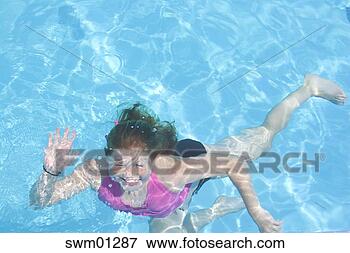 Picture - young girl waving 
underwater in 
swimming pool. 
fotosearch - search 
stock photos, 
pictures, images, 
and photo clipart