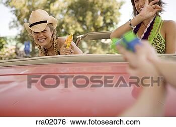 Stock Photo - young people having 
a squirt gun fight. 
fotosearch - search 
stock photos, 
pictures, images, 
and photo clipart