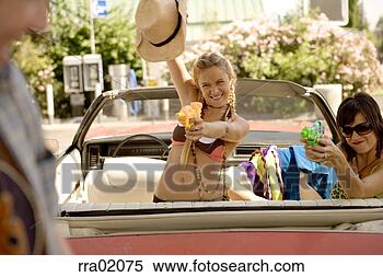 Stock Image - young women spraying 
a man with a squirt 
gun. fotosearch 
- search stock 
photos, pictures, 
images, and photo 
clipart