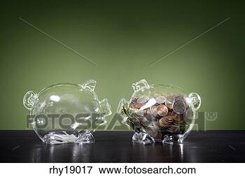 Picture - empty piggy bank 
next to full piggy 
bank. fotosearch 
- search stock 
photos, pictures, 
images, and photo 
clipart