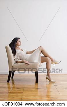 Stock Photo - portrait of latin 
american woman 
sitting in chair. 
fotosearch - search 
stock photos, 
pictures, images, 
and photo clipart