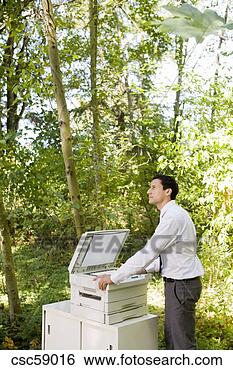 Stock Photo - businessman leaning 
on copier in woods. 
fotosearch - search 
stock photos, 
pictures, images, 
and photo clipart