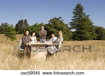 Stock Image - businesspeople 
at conference 
table in field. 
fotosearch - search 
stock photos, 
pictures, images, 
and photo clipart
