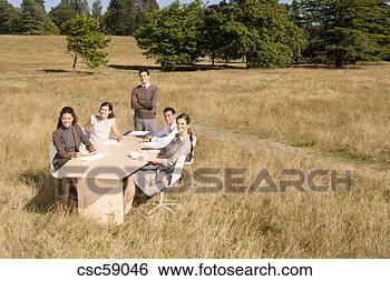 Stock Photo - businesspeople 
at conference 
table in field. 
fotosearch - search 
stock photos, 
pictures, images, 
and photo clipart