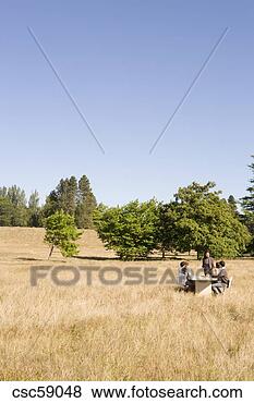 Stock Photo - businesspeople 
at conference 
table in field. 
fotosearch - search 
stock photos, 
pictures, images, 
and photo clipart